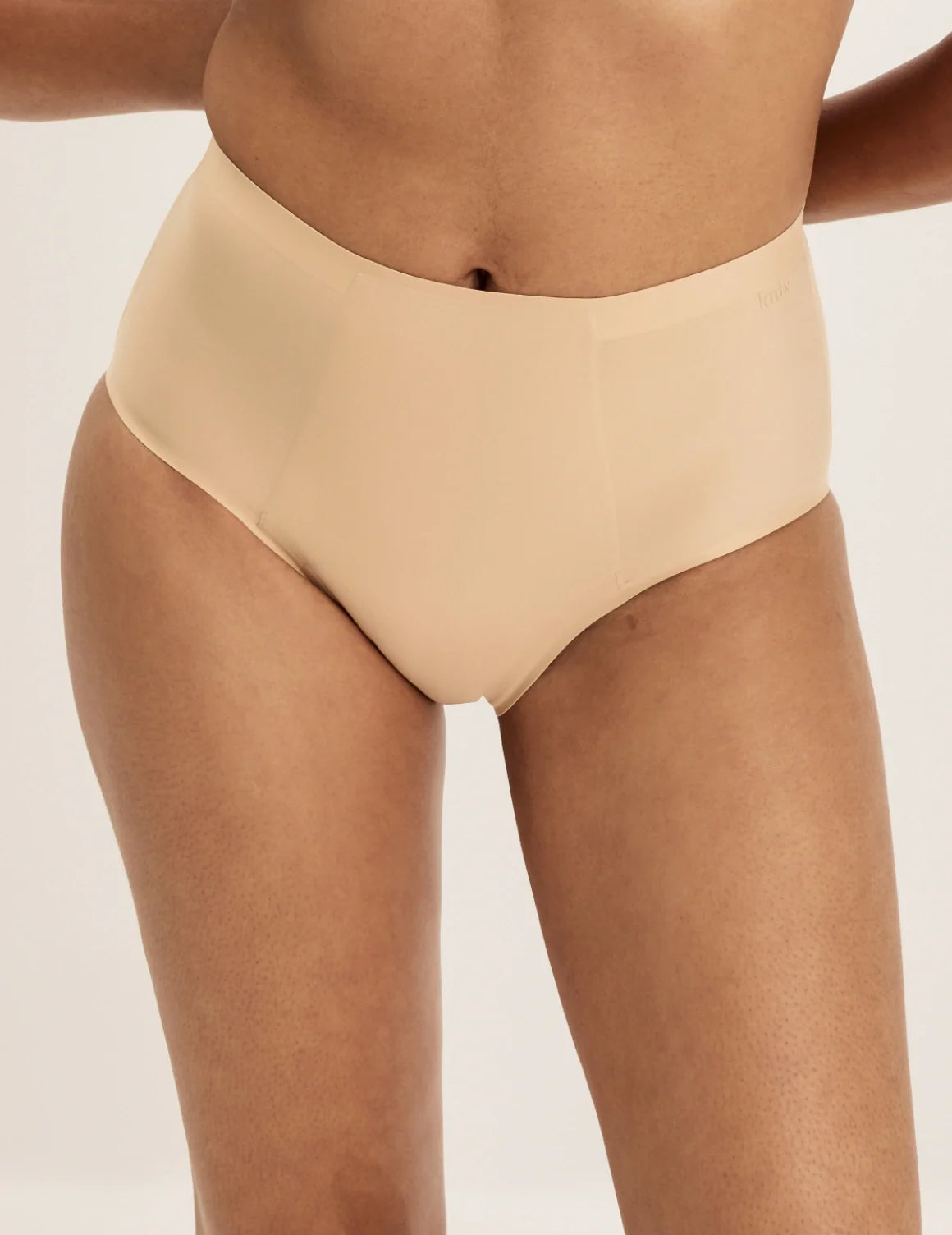 Front view of model wearing the SuperPlus Leakproof® No-Show High Rise highlighting the coverage and smooth fit – Warm Sand – view 10 of 21