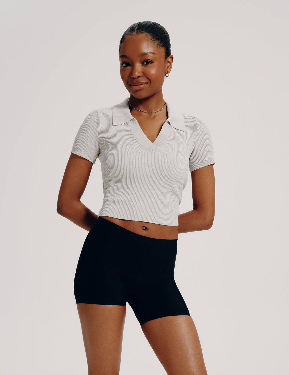 Full-body view of model wearing the Teen Leakproof Shortie highlighting the coverage and smooth fit – Black – view 1 of 6