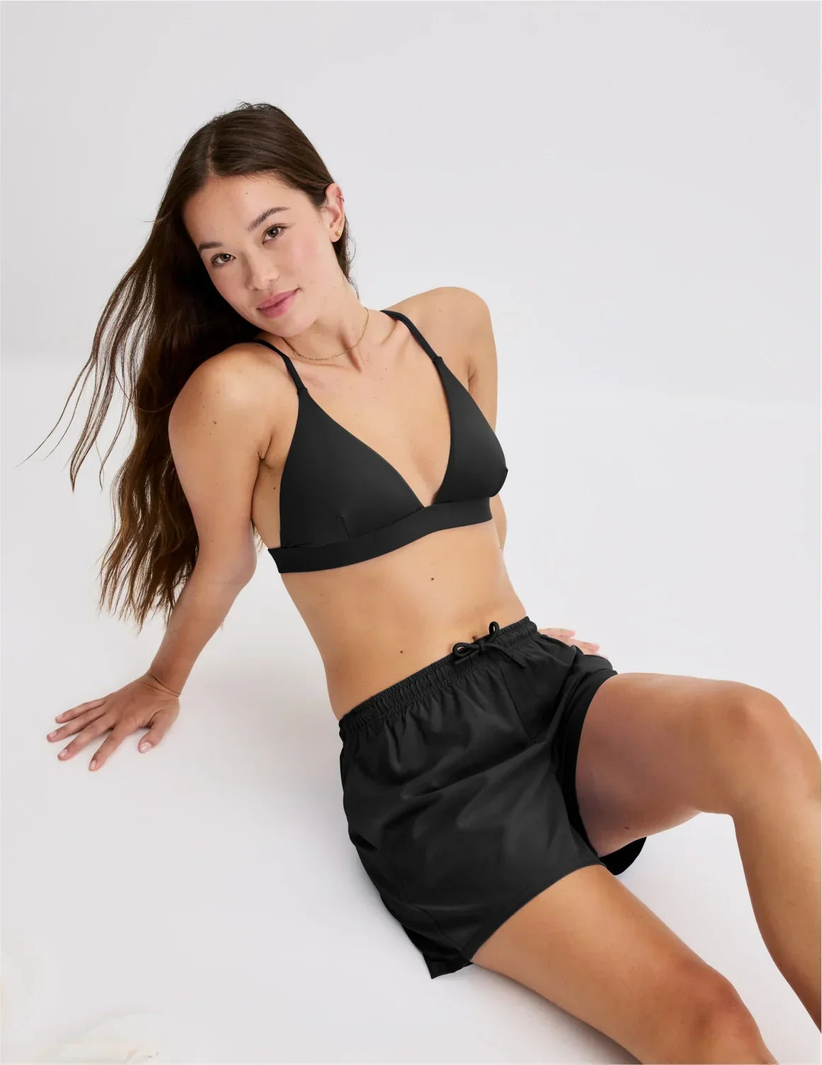 Front view of model wearing the Teen Triangle Bikini Top highlighting the neckline, strap design and fit – Black – view 1 of 48