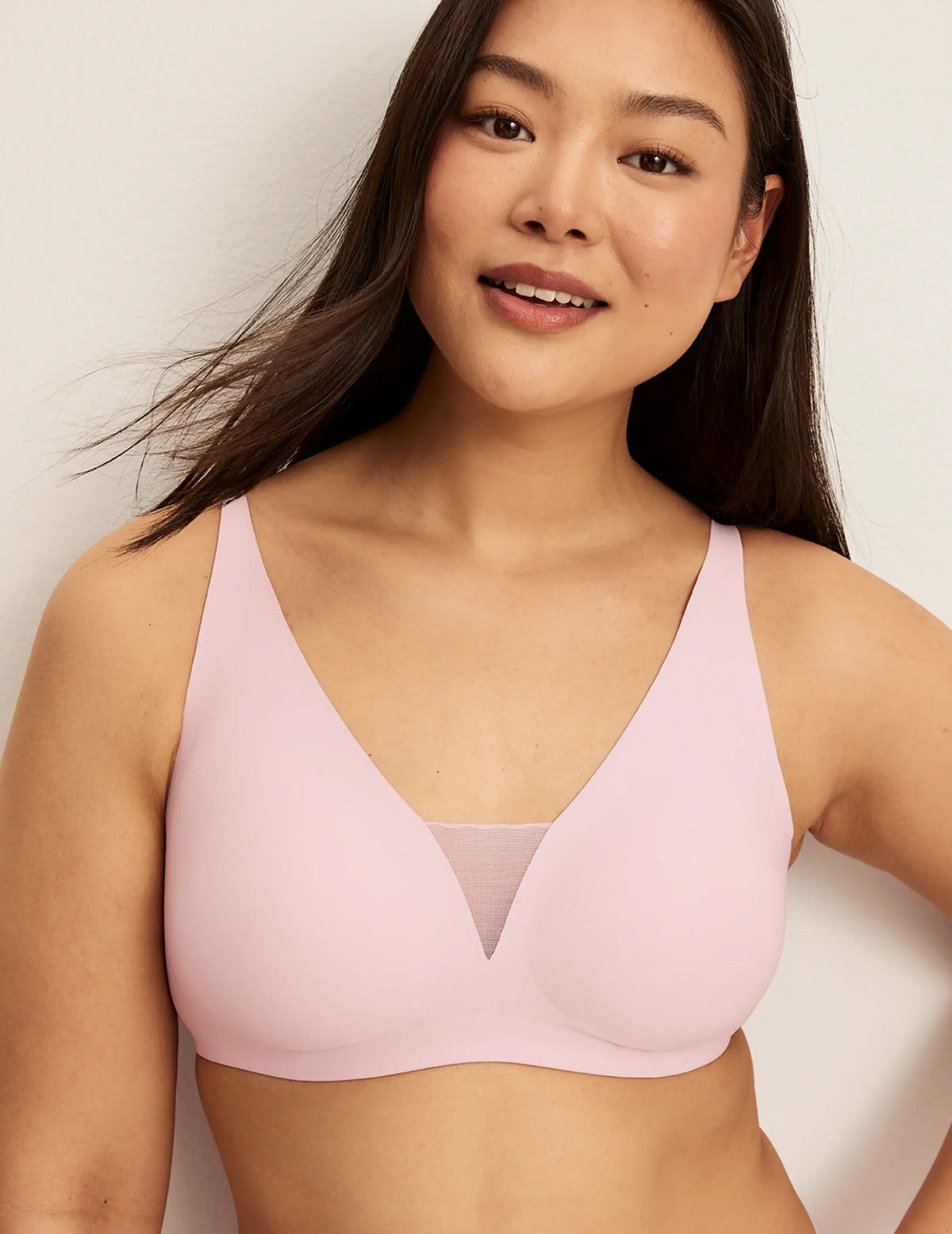 Front view of model wearing the Revolution Shadow Mesh Bra, highlighting the neckline, strap design, and silhouette – Rose Water – view 1 of 19